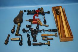 A BOX CONTAINING A VINTAGE SHOTGUN CARTRIDGE SHELL, Webley gun cleaning kit etc