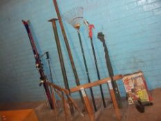 A SELECTION OF TOOLS TO INCLUDE TRESTLES, BRANCH LOPPER, SKIS AND AN ACRO SUPPORT PROP