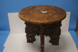 A CARVED COFFEE TABLE