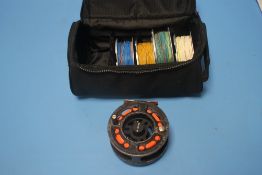 A GREYS GRXI+ 7/8 CARTRIDGE SPOOL FLY REEL and four spare spools not marked in zipped padded