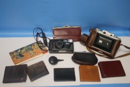 A BOX OF ASSORTED CAMERAS, PURSES, ETC