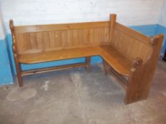 A SOLID PINE CORNER PEW