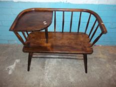 A WOODEN VINTAGE TELEPHONE BENCH SEAT IN THE STYLE OF ERCOL