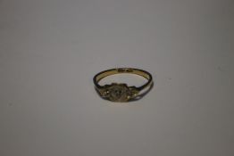 AN 18 CT GOLD LADIES RING SET WITH THREE SMALL DIAMONDS APPROX 2 GRAMS