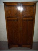 AN OAK WARDROBE