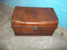 AN ANTIQUE METAL TRAVEL TRUNK