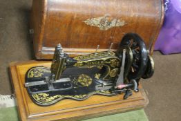 A CASED SINGER SEWING MACHINE