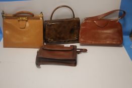 A VINTAGE LEATHER HANDBAG with metal clasps, no maker's labels together with a Katana of Paris