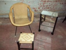 A MIRRORED THREE DRAWER CHEST, A RETRO WICKER CHAIR AND A STOOL