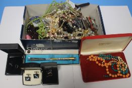 A BOX OF ASSORTED COSTUME JEWELLERY MAINLY NECKLACES AND CUFFLINKS ETC
