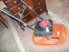 A LARGE PETROL HOVER MOWER