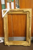 A LARGE GILT FRAME 88 CM X 120 CM
