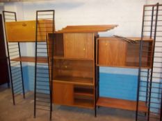 A RETRO TEAK LADDERAX BOOKCASE MODULAR UNIT WITH FOUR UPRIGHTS