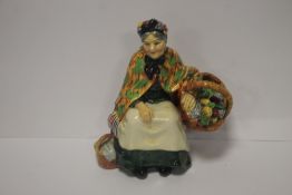 AN EARLY ROYAL DOULTON FIGURINE 'THE OLD LAVENDER SELLER' HN1492