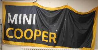A MINI COOPER ORIGINAL DEALERS SHOWROOM BANNER, in gold, black and white, approx. 145 x 350 cm