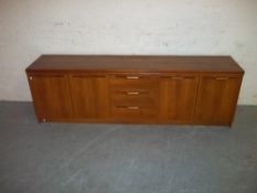 A MODIFIED RETRO TEAK SIDEBOARD
