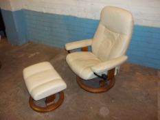 A CREAM EKORNES STRESSLESS SWIVEL RECLINER AND ADJUCTABLE FOOT STOOL