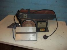 A BENCH TOP DUAL BELT SANDER AND DISK SANDER