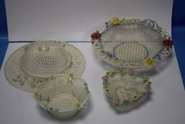 A DONEGAL PARIAN CHINA PIERCED HAT TOGETHER WITH THREE SIMILAR BASKETS