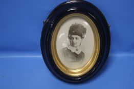 A BELLEEK PORTRAIT PLAQUE OF A VICTORIAN LADY IN A EBONISED FRAME 23 CM X 29 cm