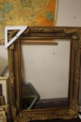 A LARGE GILT FRAME 88 CM X 120 CM