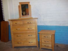 A MODERN OAK FIVE DRAWER, 2 OVER 3 DRAWER CHEST, A THREE DRAWER CHEST BEDSIDE CABINET AND A CHEVAL