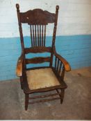 AN ANTIQUE OAK CARVER CHAIR A/F