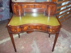A REPRODUCTION EDWARDIAN STYLE LEATHER INLAID WRITING DESK