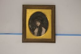 A MINIATURE PORTRAIT IN GILT FRAME