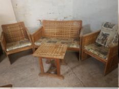 AN OAK MODERN LATTICE STYLE GARDEN SUITE COMPRISING TWO SEATER, TWO CHAIRS AND A TABLE