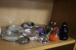 A COLLECTION OF ELEVEN ASSORTED GLASS PAPERWEIGHTS