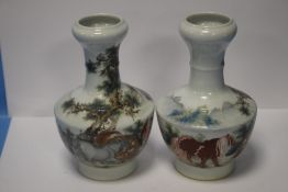 A PAIR OF ORIENTAL VASES, NO MARKS TO BASE - HEIGHT APPROXIMATELY 21.5 cm