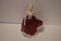 A ROYAL DOULTON FIGURINE - FIONA