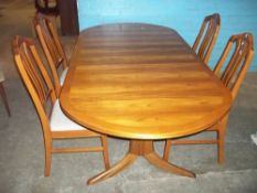 A RETRO PARKER KNOLL EXTENDING TEAK OVAL DINING SET WITH FOUR CHAIRS