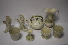 A COLLECTION OF EIGHT BELLEEK ORNAMENTS, TO INCLUDE TEAPOT ETC, ALL WITH GREEN STAMP TO BASE
