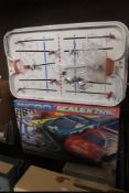 A TABLE TOP ICE HOCKEY GAME TOGETHER WITH A BOXED MICRO SUPER ENDURANCE SCALEXTRIC