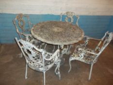 A VINTAGE ALUMINIUM GARDEN TABLE AND FOUR CHAIRS SET (ARM MISSING FROM ONE CHAIR)