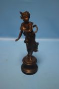 A SPELTER STYLE STATUE ON CIRCULAR PLINTH A/F