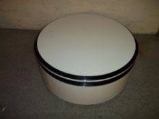 A MODERN ROUND STORAGE COFFEE TABLE