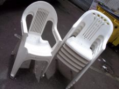 A SELECTION OF STACKABLE WHITE GARDEN CHAIRS