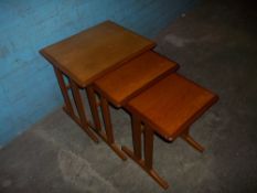 A RETRO STAG TEAK NEST OF THREE TABLES