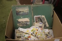 A LARGE QUANTITY OF TEA CARDS, CIGARETTE CARDS, POSTCARDS ETC IN ALBUMS AND LOOSE
