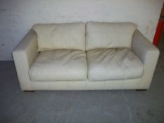 A LEATHER TWO SEATER SOFA