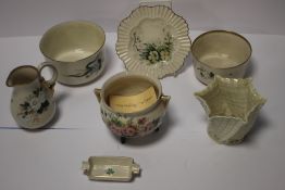 SEVEN BELLEEK ITEMS, TO INCLUDE AN UNUSUAL THREE LEGGED POT, JUG, PLATE, THREE BOWLS ETCALL WITH