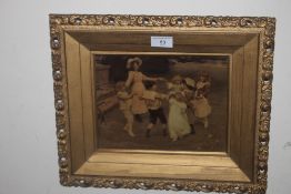 A FRAMED AND GLAZED CHRYSTOLEUM, depicting children doing ring of roses 39 x 33 cm