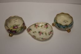 TWO SMALL BELLEEK SHALLOW BOWLS, APPROX 2.5 cm IN HEIGHT, AND A BELLEEK SHELL TYPE FISH (THREE)