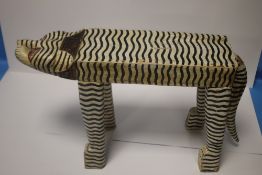 A WOODEN STOOL IN THE FORM OF A BENGAL TIGER