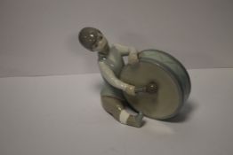 A LLADRO FIGURE OF A BOY PLAYING A DRUMCondition Report:Foot has been repaired