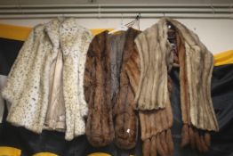 A COLLECTION OF FUR STOLES AND A COAT