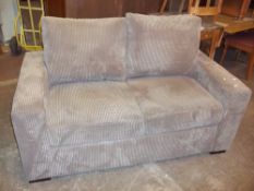 A MODERN JUMBO CHORD TWO SEATER SOFA